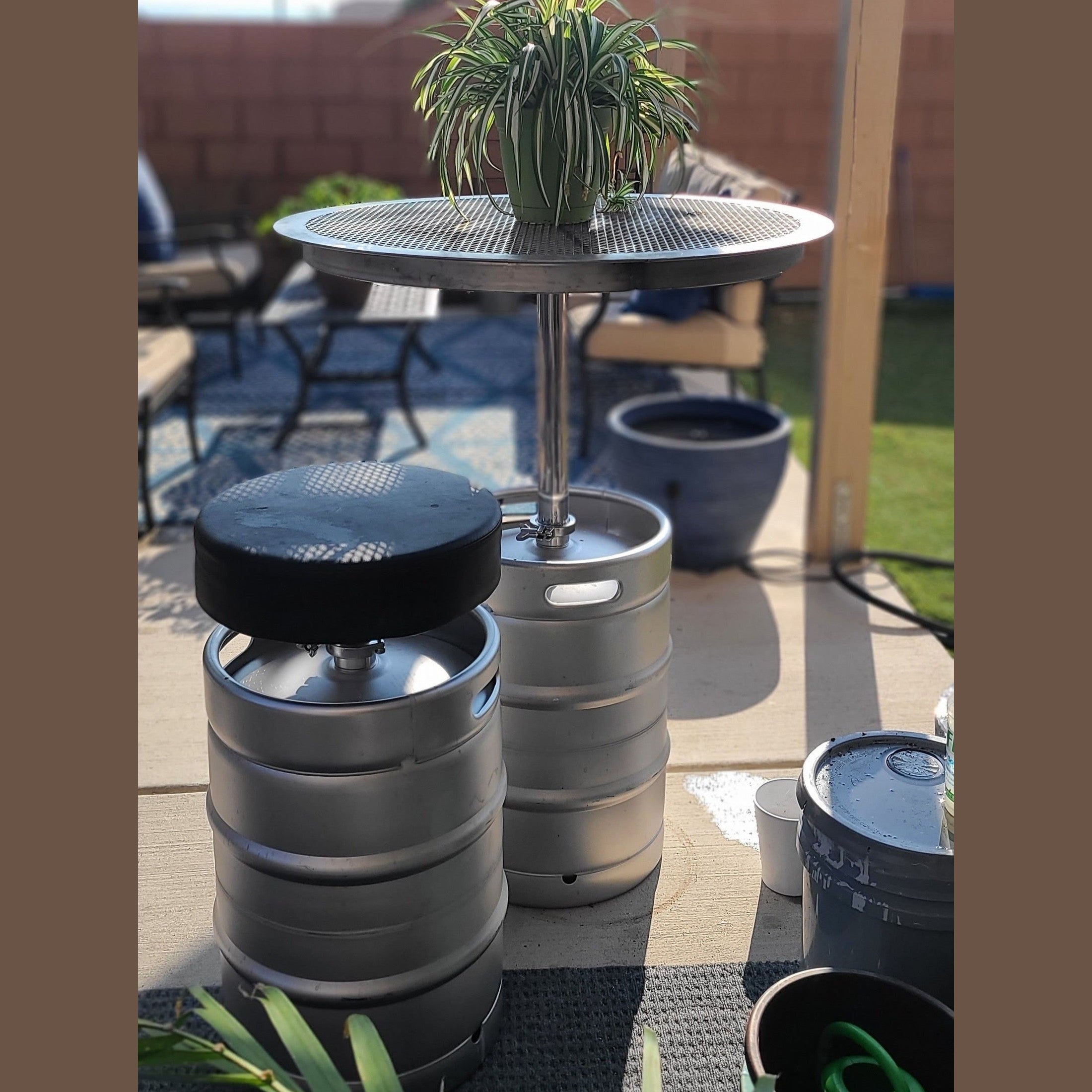 Stainless Keg Table with Keg Stool on a patio