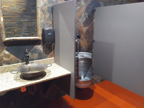 Bathroom vanity with vessel sink and keg urinal